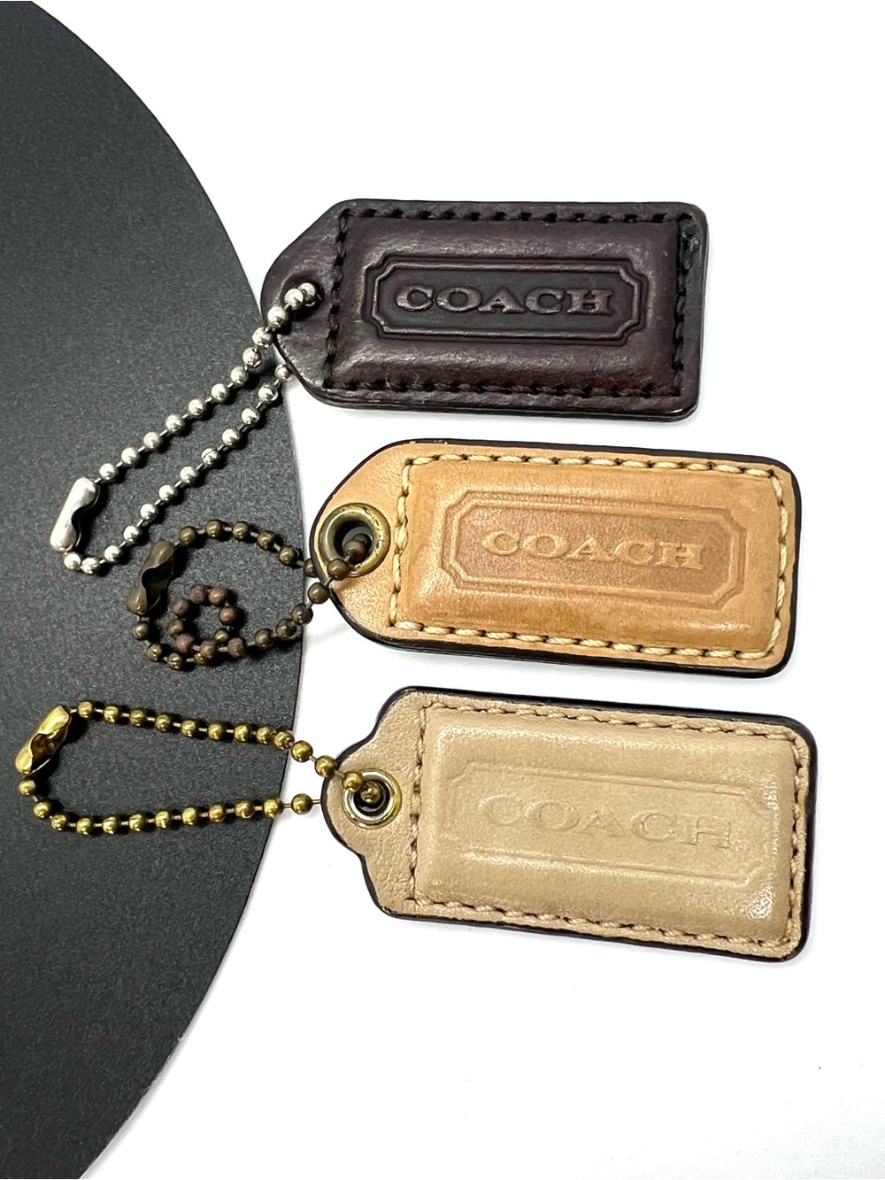 Coach Leather Bag Tag Trio in Dark Brown, Tan, Cream